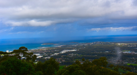 View of Coffs Harbour from Forest Sky Pier, which is a lookout pier with sweeping views on a cloudy day.