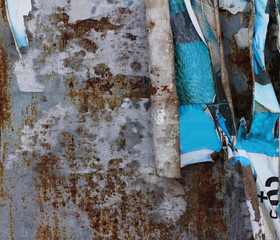 Old grunge ripped torn vintage collage posters and creased crumpled paper surface texture background