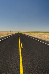  yellow lines on a  empty highway usa