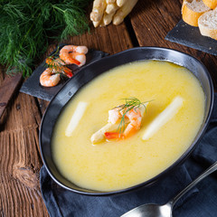 Super delicious asparagus soup with crab and capers .