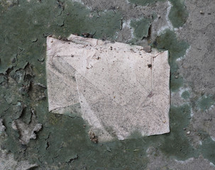 old torn paper on dry soil texture background