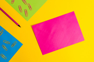 Blank paper sheets message pencil clips binders plain colored background