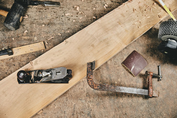 Carpentry equipment tools on work table and wood