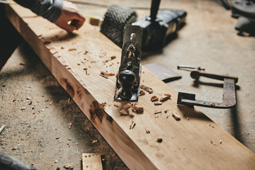 Carpentry equipment tools on work table and wood