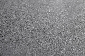 Black plastic texture. Close up. Top view.