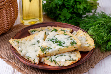 Pancake with cheese and herbs on a plate