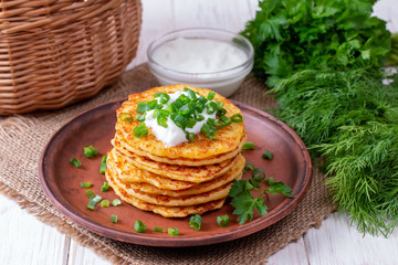 Pancakes with cheese with sour cream