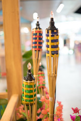 An oil lamp or pelita with bamboo holder for Eid ul fitr decoration.