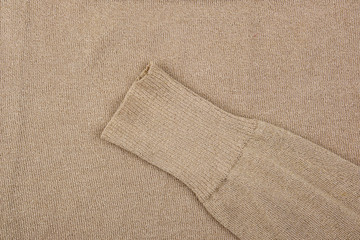fragment of golden cotton fabric for making clothes and a sleeve