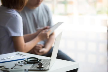 Fototapeta premium Smiling doctor and patient are discussing something