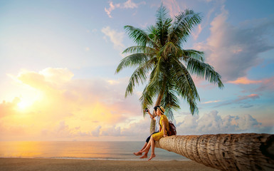 Asian couple selfie by camera on coconut palm tree in Kho Mak island - obrazy, fototapety, plakaty