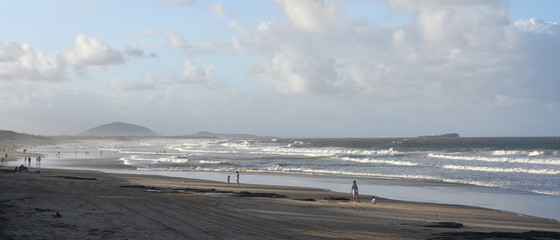 Alex beach, Australia - Apr 21, 2019. People relaxing at the beach in Autumn time afternoon.  Alex is a coastal town situated on Queensland's Sunshine Coast.