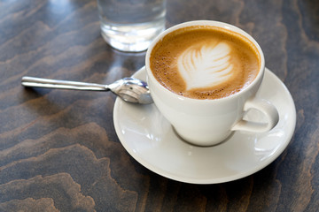 Cup of cappuccino coffee closeup