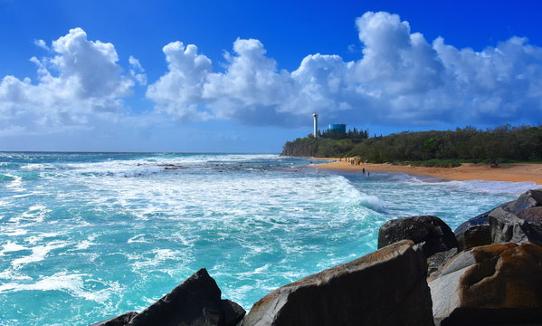 People relaxing on Buddina Beach along Pacific Boulevard (Sunshine Coast, Queensland, Australia) on a beautiful day.