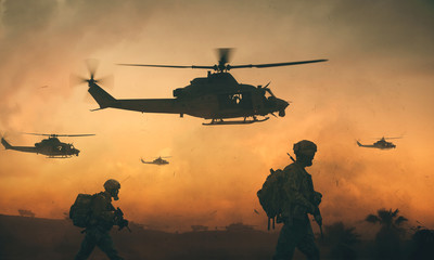 Militaire en helikoptertroepen op weg naar het slagveld bij zonsondergang.