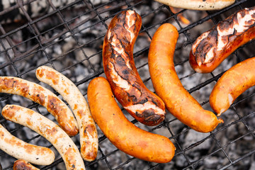 Fototapeta premium sausages or sausages on the grill. cooking sausages in the open air.