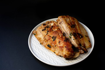 fillet of fried fish on a plate 