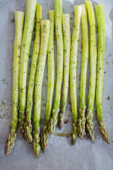 fresh green asparagus with herbs and oil