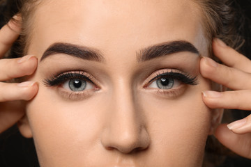 Fototapeta na wymiar Young woman with beautiful eyebrows, closeup