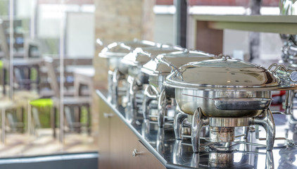 Chafing dish heaters at the banquet table.