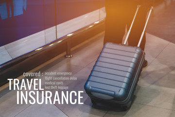 Travel Insurance concept: Traveler luggage walking at airport terminal for checkin at airport departure lounge with word 