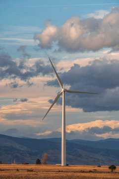 Wind turbine against a background of cloudy sky