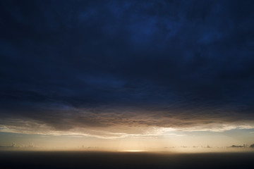 Fototapeta na wymiar A big blue stormy cloud over the ocean