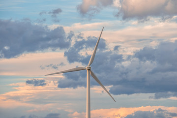 Wind turbine against a background of cloudy sky