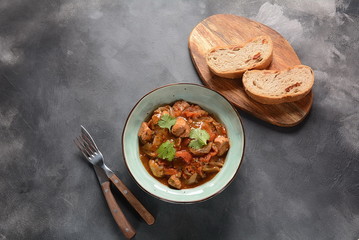 Chakhokhbili - traditional Georgian dish. Chicken stewed with fresh coriander tomatoes and herbs