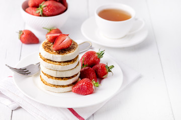Tasty Homemade Cottage Cheese Pancakes with Strawberries on White Plate Tasty Healthy Diey Breakfast Breakfast Concept Horizontal Copy Space