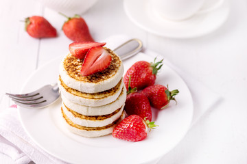 Tasty Homemade Cottage Cheese Pancakes with Strawberries on White Plate Tasty Healthy Diey Breakfast Breakfast Concept Above Horizontal