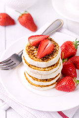 Stack of Tasty Homemade Cottage Cheese Pancakes with Strawberries on White Plate Tasty Healthy Diey Breakfast Breakfast Concept Vertical