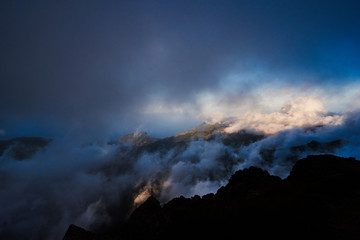 Mountain view from pico de arieiro with mountains, ocean, clouds and blue sky