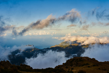 Mountain view from pico de arieiro with mountains, ocean, clouds and blue sky