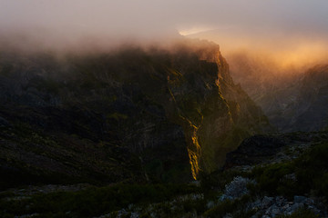 Mountain at sunset with gold clouds in Madeira,pico de arieiro
