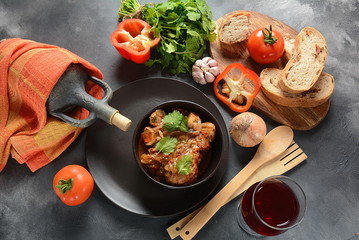 Chakhokhbili - traditional Georgian dish. Chicken stewed with fresh coriander tomatoes and herbs