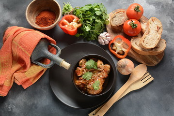 Chakhokhbili - traditional Georgian dish. Chicken stewed with fresh coriander tomatoes and herbs 