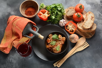Chakhokhbili - traditional Georgian dish. Chicken stewed with fresh coriander tomatoes and herbs