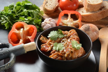 Chakhokhbili - traditional Georgian dish. Chicken stewed with fresh coriander tomatoes and herbs