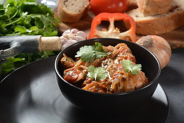 Chakhokhbili - traditional Georgian dish. Chicken stewed with fresh coriander tomatoes and herbs