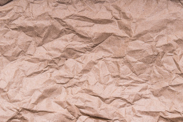 Brown crumpled craft paper texture, background