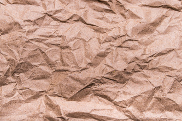 Brown crumpled craft paper texture, background
