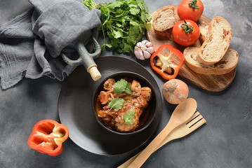 Chakhokhbili - traditional Georgian dish. Chicken stewed with fresh coriander tomatoes and herbs