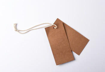 empty paper brown tag on the rope, white background