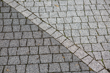 Material for sidewalk. Grey paving stone. Background.