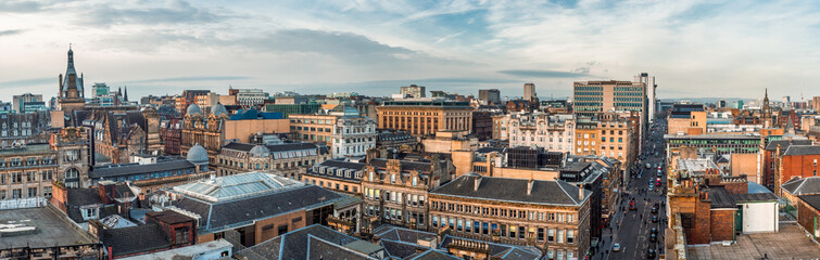 A wide panoramic looking out over old and new buildings and streets in Glasgow city centre....