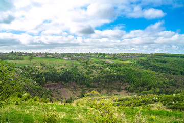 Panoramic view of village in spring mountain forest