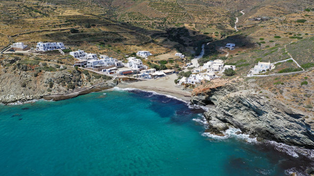 Aerial drone photo of secluded deep turquoise beach of Agios Nikolaos with crystal clear sea and sandy sea shore, Folegandros island, Cyclades, Greece