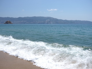 Scenery of white waves at bay of ACAPULCO city in Mexico and Pacific Ocean landscape