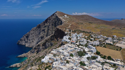 Aerial drone photo of picturesque main village (chora) of Folegandros island featuring uphill...